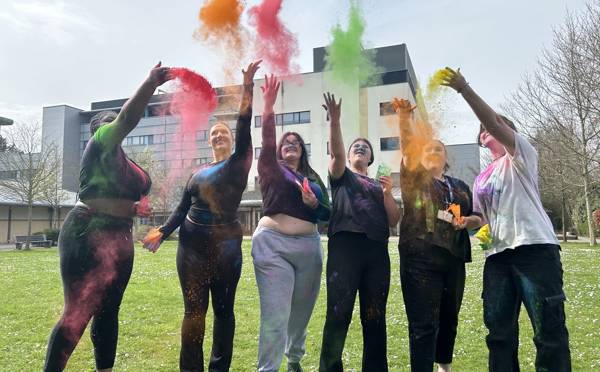 Students throwing paint to celebrate the Holi Festival